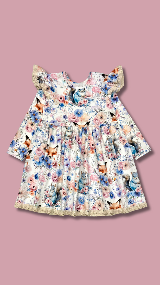 Floral dress with fox pattern on a pink background